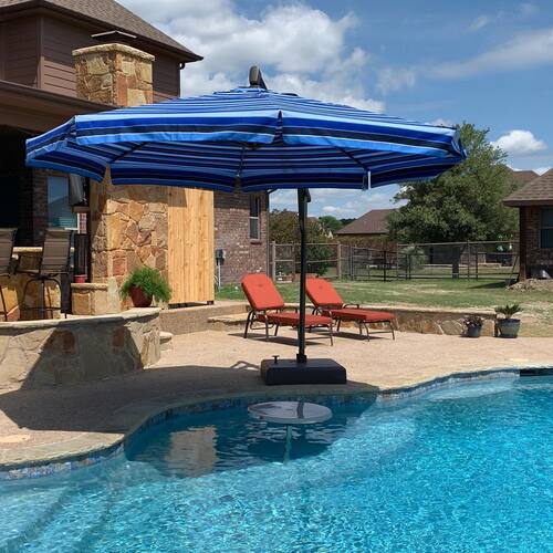 patio umbrella next to a pool