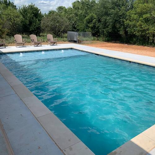 chairs around a swimming pool