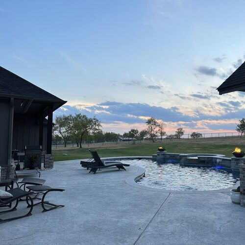 pool surrounded by a patio