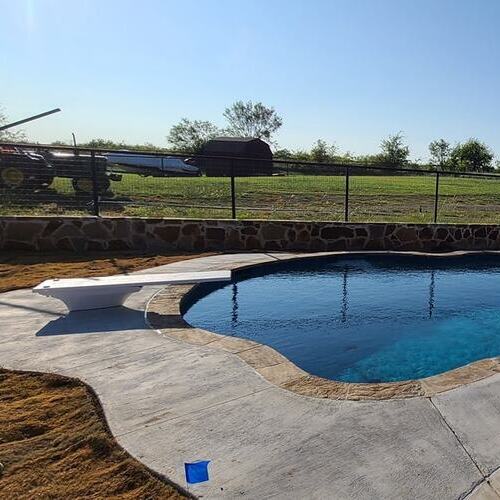 diving board in front of a swimming pool